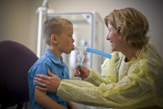 Nurse-Gowned-Young-Boy-Breath-Test.jpg